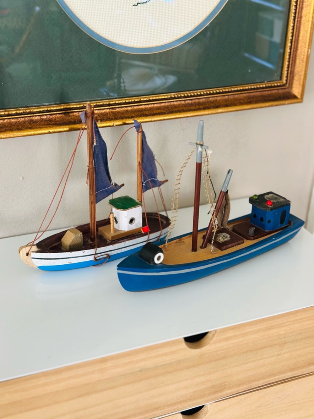 Vintage pair of miniature wooden fishing boat
